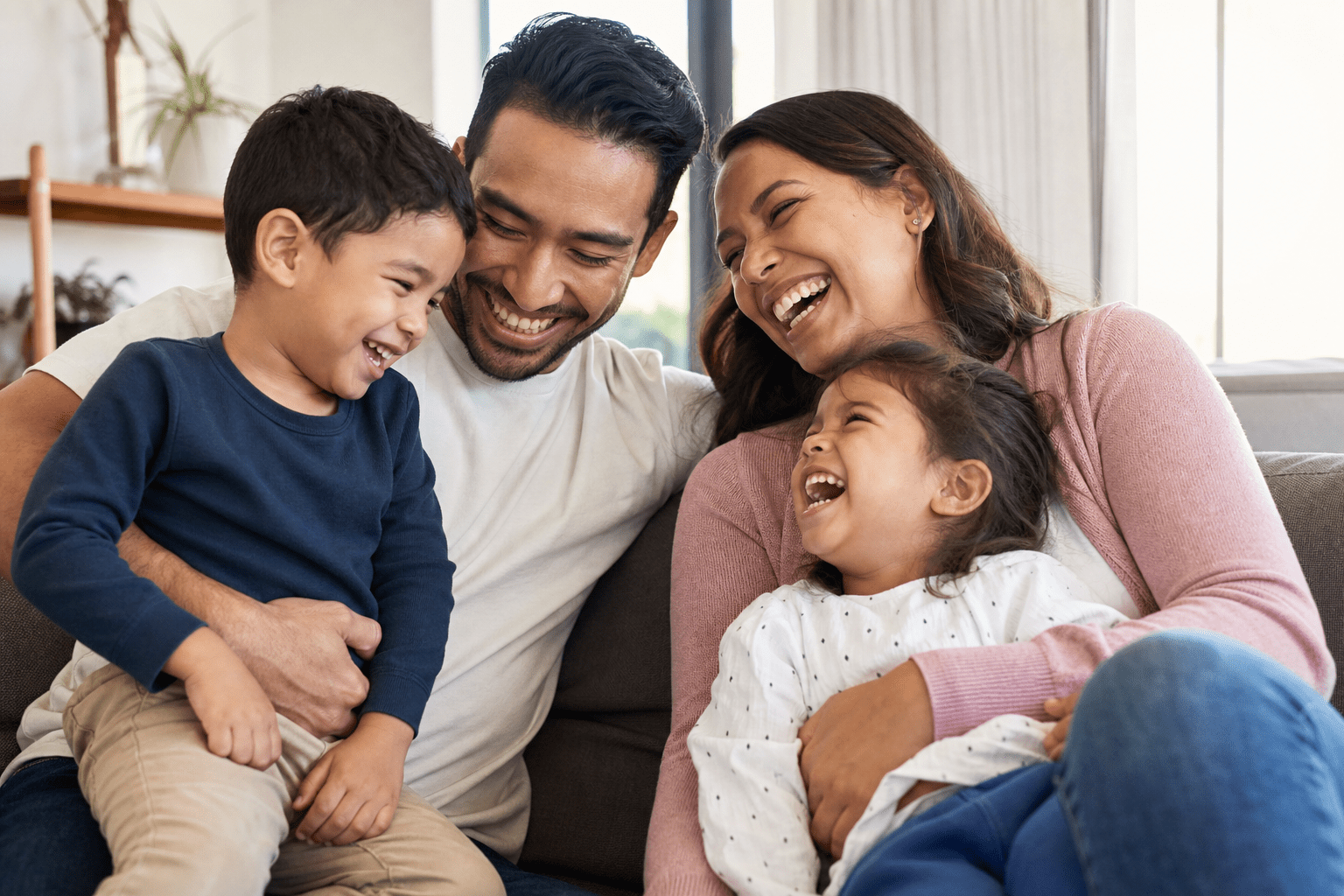 Happy young family with health insurance coverage